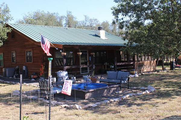 10.9 Acres of Land with Home for Sale in Utopia, Texas