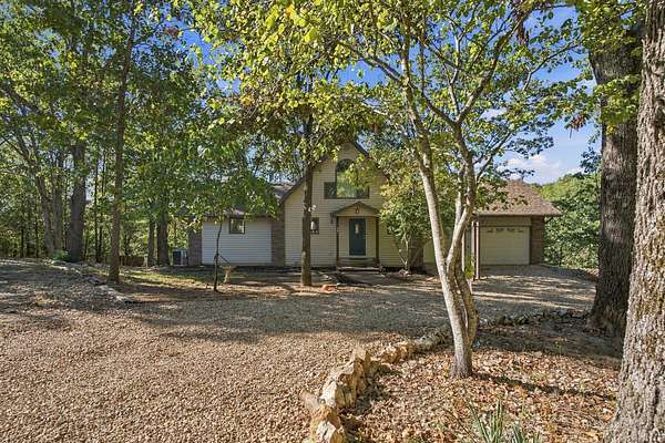6.9 Acres of Land with Home for Sale in Highlandville, Missouri
