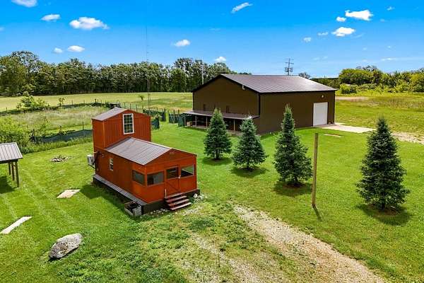 4.1 Acres of Land with Home for Auction in Reading, Michigan