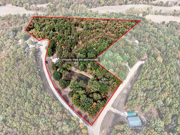 16.1 Acres of Recreational Land with Home for Sale in Tunas, Missouri