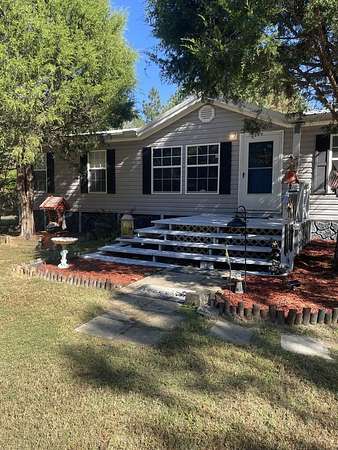 23.4 Acres of Land with Home for Sale in Camden, Tennessee