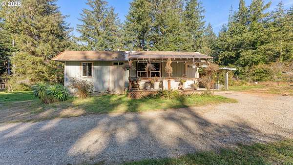 4.53 Acres of Land with Home for Sale in Sixes, Oregon