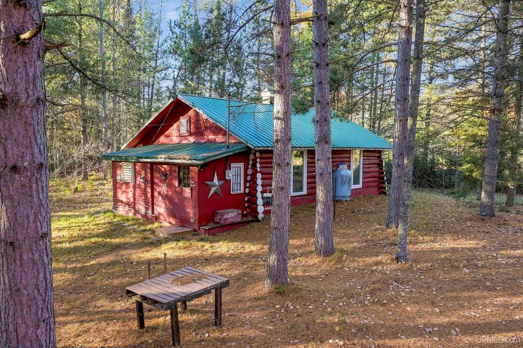 10 Acres of Recreational Land with Home for Sale in Rapid River, Michigan
