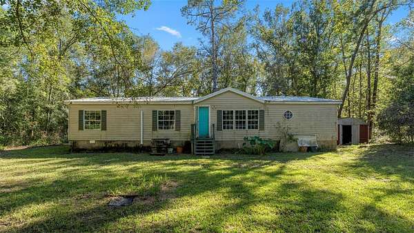 7.43 Acres of Land with Home for Sale in Alachua, Florida