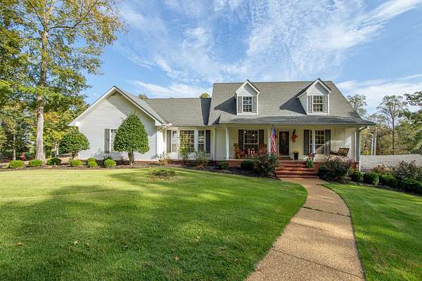 9.79 Acres of Land with Home for Sale in Savannah, Tennessee