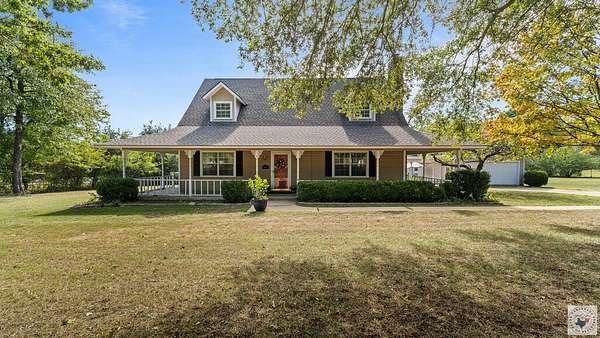 9.44 Acres of Land with Home for Sale in Atlanta, Texas