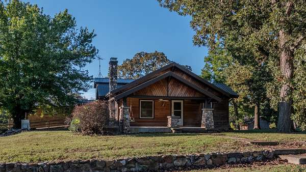 74 Acres of Land with Home for Sale in Humansville, Missouri