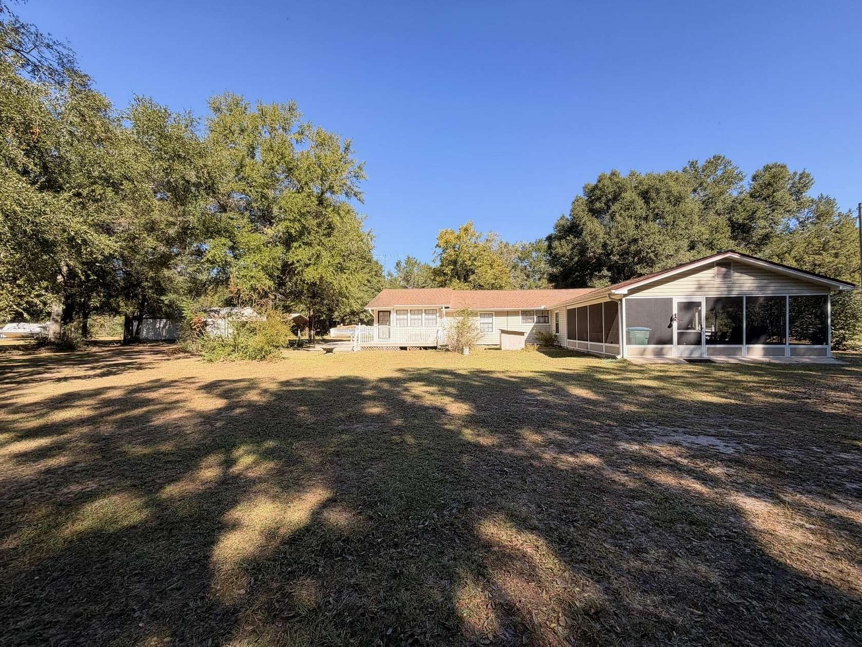 10 Acres of Recreational Land with Home for Sale in Holt, Florida