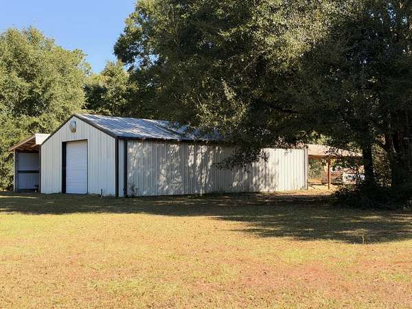 20 Acres of Recreational Land with Home for Sale in Holt, Florida