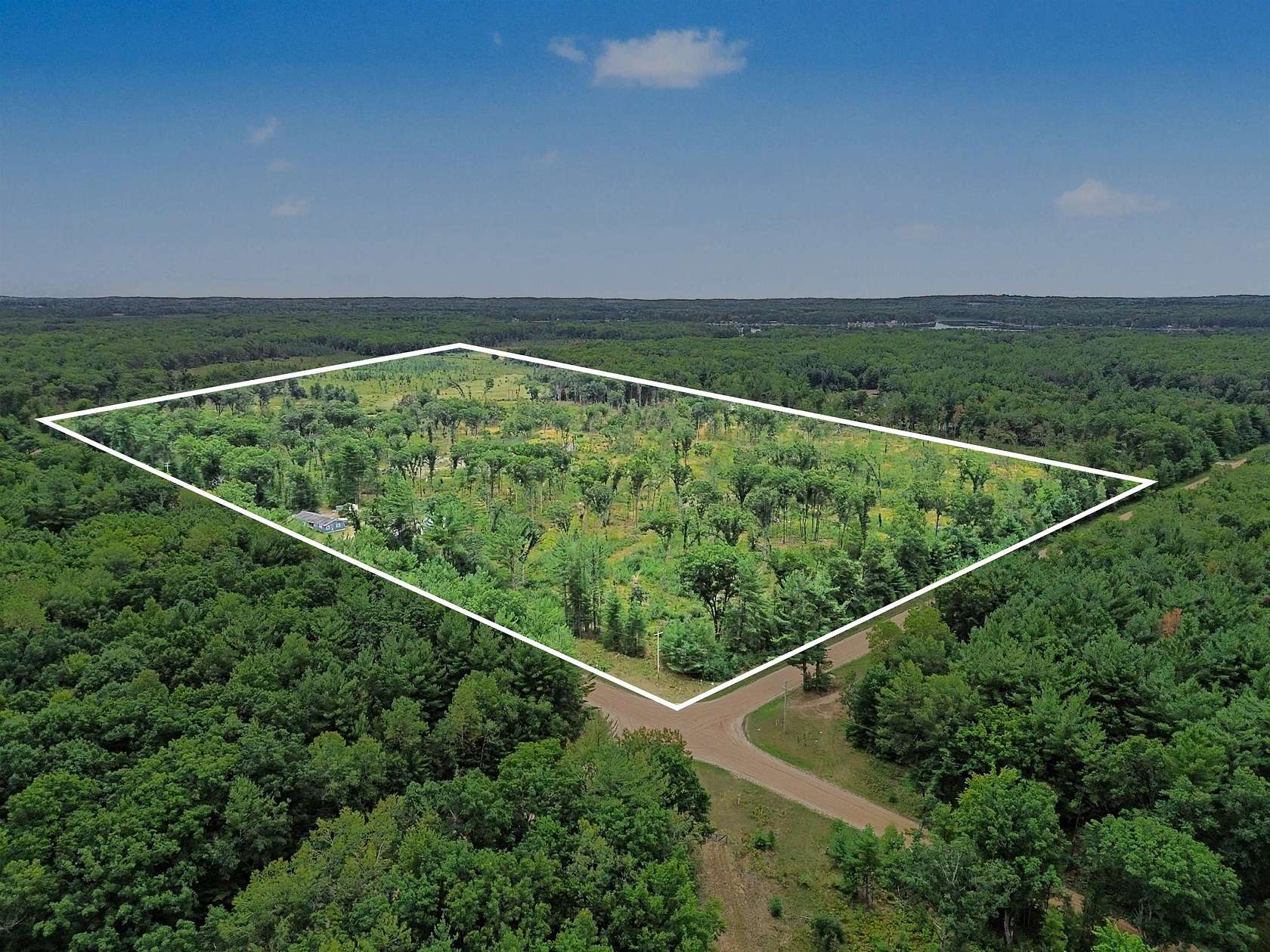 77 Acres of Recreational Land with Home for Sale in Lake, Michigan
