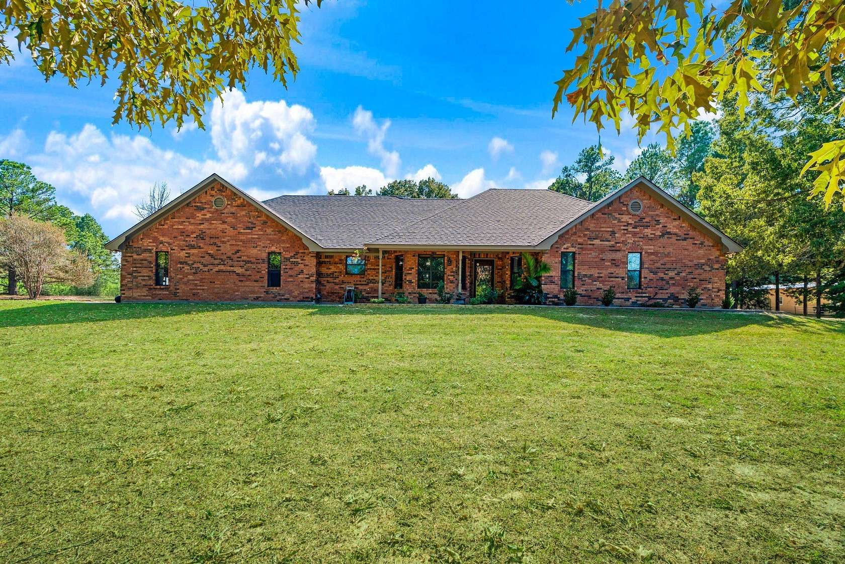 11.2 Acres of Recreational Land with Home for Sale in Powderly, Texas