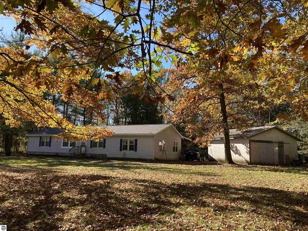 2.45 Acres of Land with Home for Sale in Lupton, Michigan