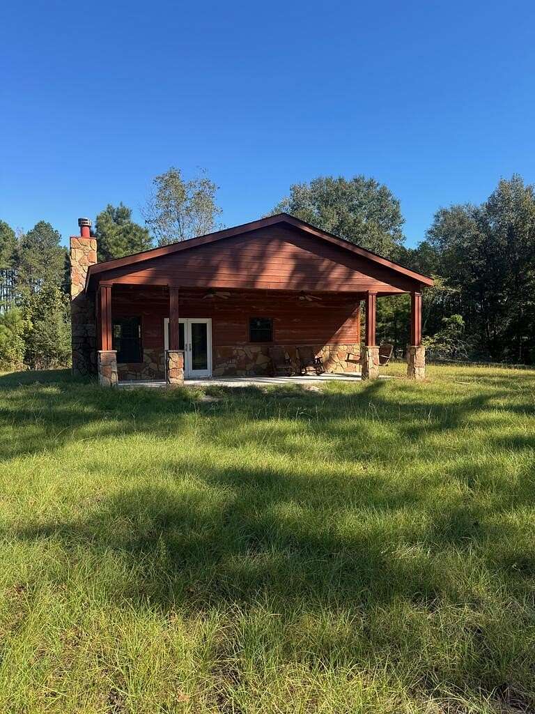 26.2 Acres of Recreational Land with Home for Sale in Corrigan, Texas