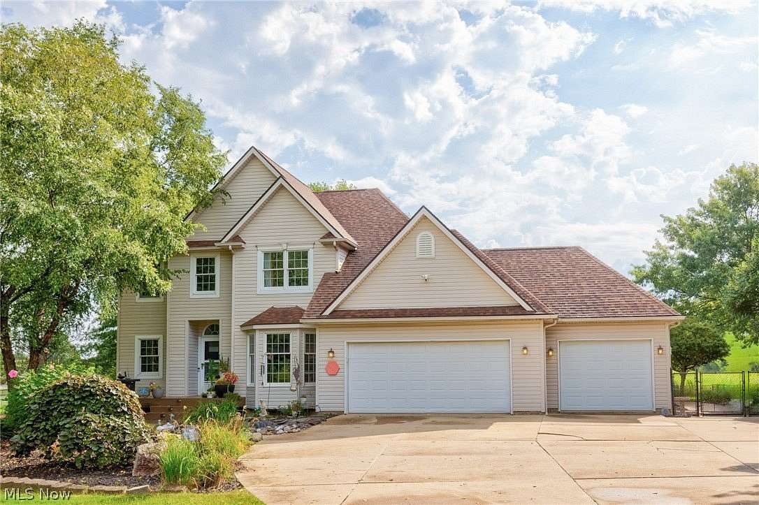 6.56 Acres of Land with Home for Sale in Louisville, Ohio