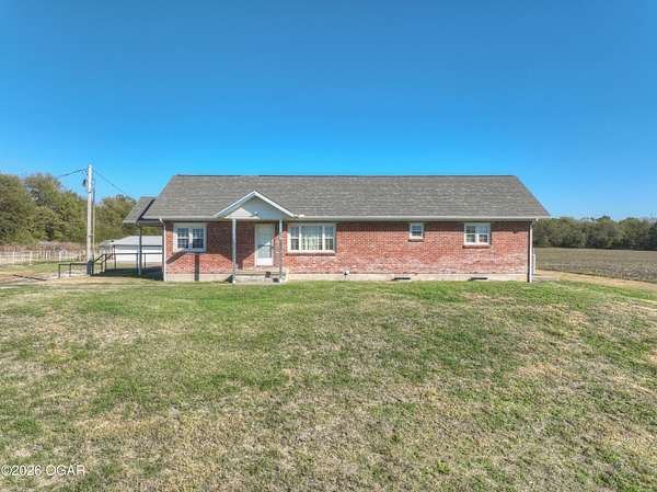 68.9 Acres of Land with Home for Sale in Carthage, Missouri