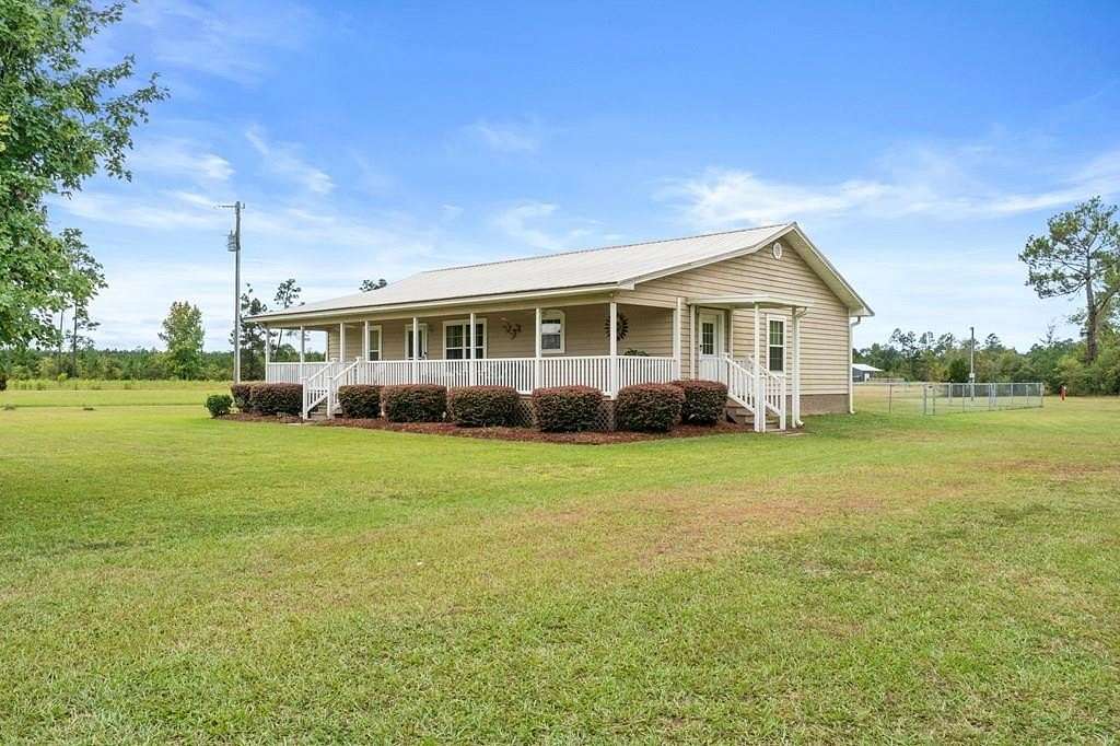 9.2 Acres of Land with Home for Sale in Wewahitchka, Florida