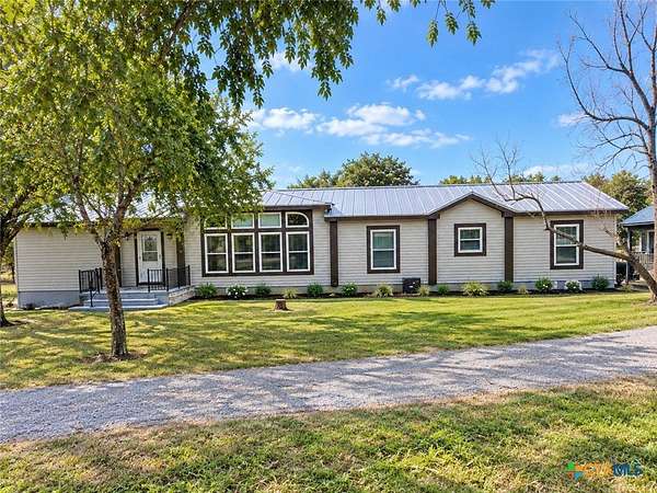 6.83 Acres of Land with Home for Sale in Floresville, Texas