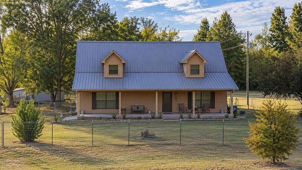 6.4 Acres of Land with Home for Sale in Holcomb, Mississippi