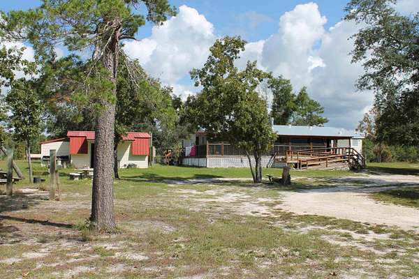 6.5 Acres of Land with Home for Sale in Perry, Florida