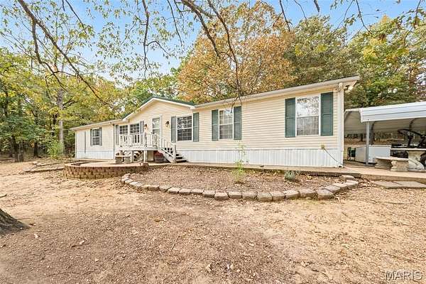 16.3 Acres of Land with Home for Sale in Fairdealing, Missouri