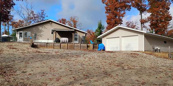 11.8 Acres of Recreational Land with Home for Sale in Cadillac, Michigan