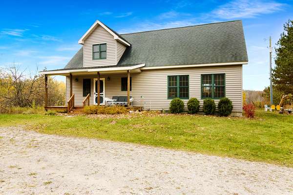 16.3 Acres of Recreational Land with Home for Sale in Boyne Falls, Michigan