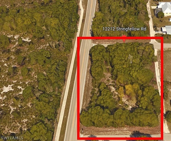 0.9 Acres of Commercial Land for Sale in Bokeelia, Florida