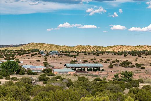 312 Acres of Agricultural Land with Home for Sale in Lamy, New Mexico