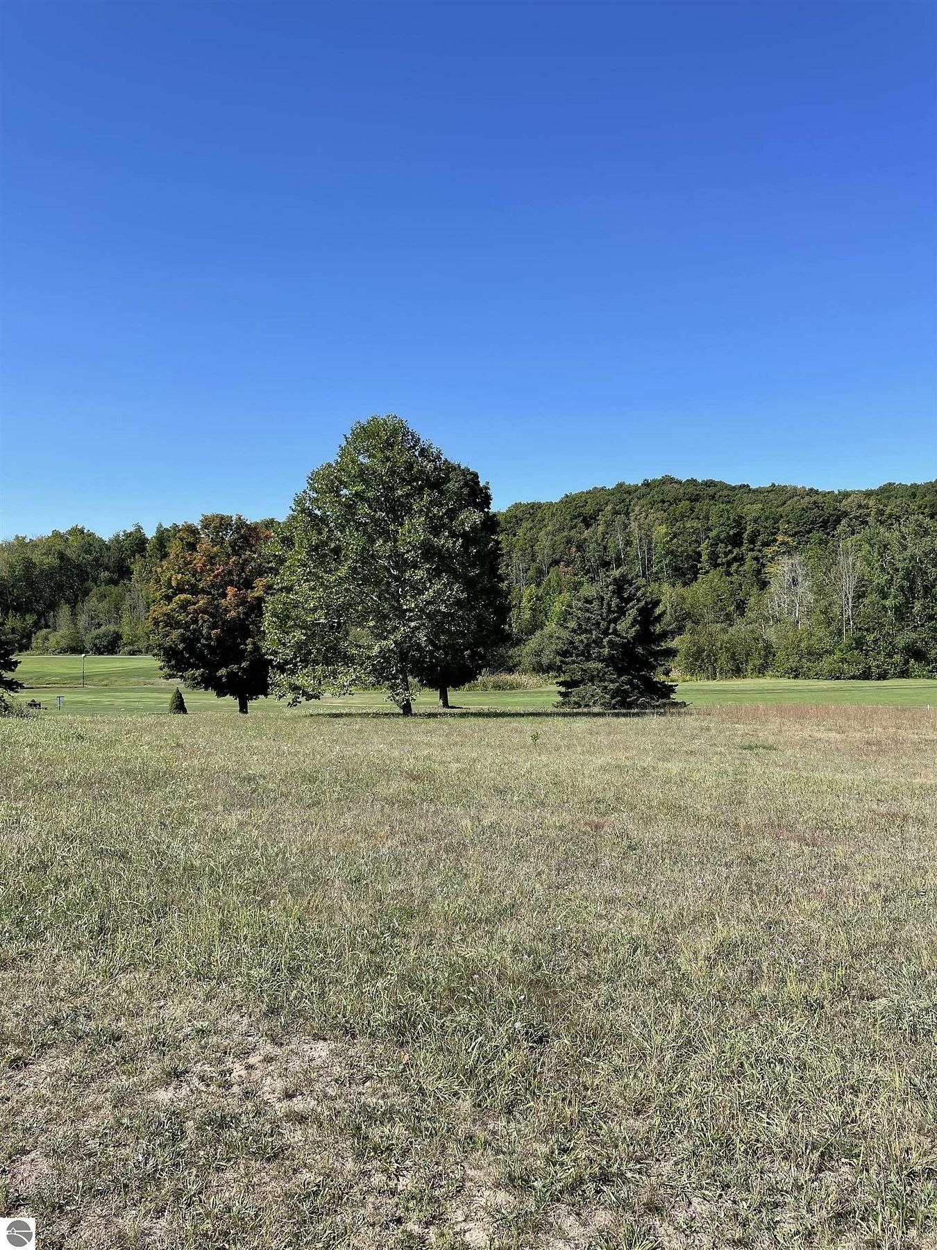 0.58 Acres of Residential Land for Sale in Kewadin, Michigan