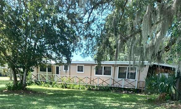 6.1 Acres of Land with Home for Sale in Mims, Florida