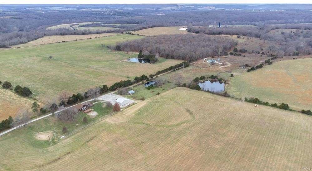 173 Acres of Agricultural Land with Home for Sale in Lebanon, Missouri