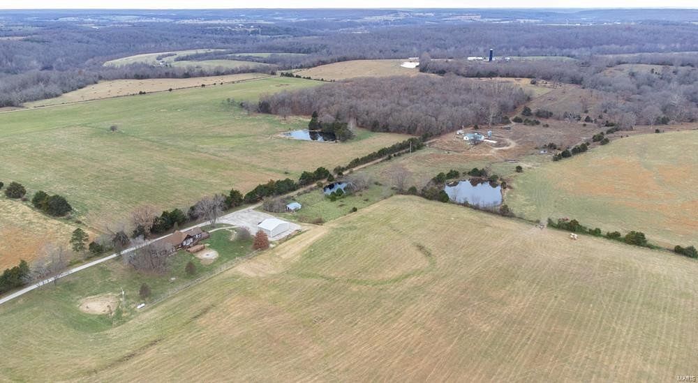 173 Acres of Land with Home for Sale in Lebanon, Missouri
