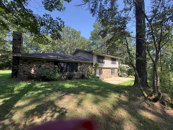5.7 Acres of Residential Land with Home for Sale in Calhoun City, Mississippi
