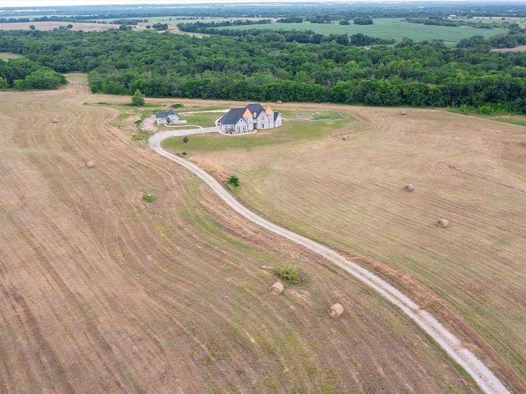25 Acres of Land with Home for Sale in Wolfe City, Texas