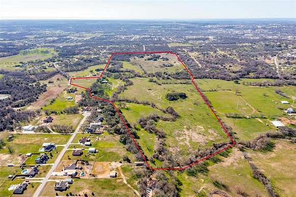 129 Acres of Agricultural Land with Home for Sale in Weatherford, Texas