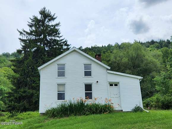 14 Acres of Land with Home for Sale in Sanford Town, New York