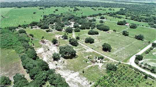 22.9 Acres of Land with Home for Sale in Moore Haven, Florida