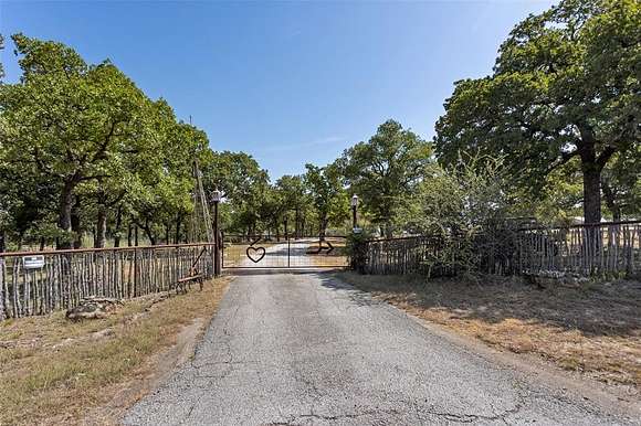 33.3 Acres of Agricultural Land with Home for Sale in Poolville, Texas