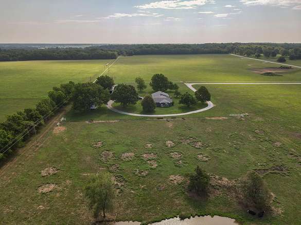 112 Acres of Agricultural Land with Home for Sale in Springfield, Missouri