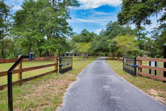 44 Acres of Agricultural Land with Home for Sale in Redbay, Florida