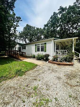 1.24 Acres of Residential Land with Home for Sale in Pittsburg, Missouri