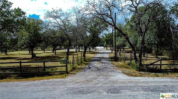 10 Acres of Residential Land with Home for Sale in Poteet, Texas