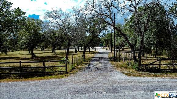 10 Acres of Residential Land with Home for Sale in Poteet, Texas