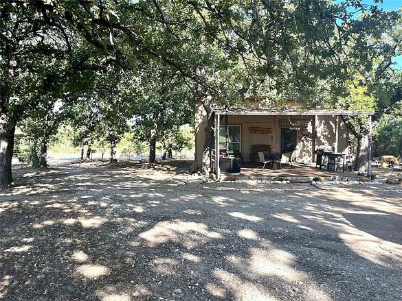 31.1 Acres of Agricultural Land with Home for Sale in Comanche, Texas
