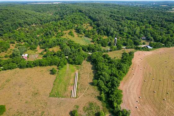 218 Acres of Agricultural Land with Home for Sale in Conway, Missouri