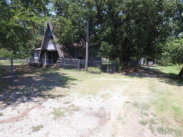 10 Acres of Residential Land with Home for Sale in Honey Grove, Texas