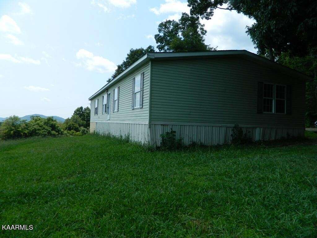24 Acres of Agricultural Land with Home for Sale in Washburn, Tennessee