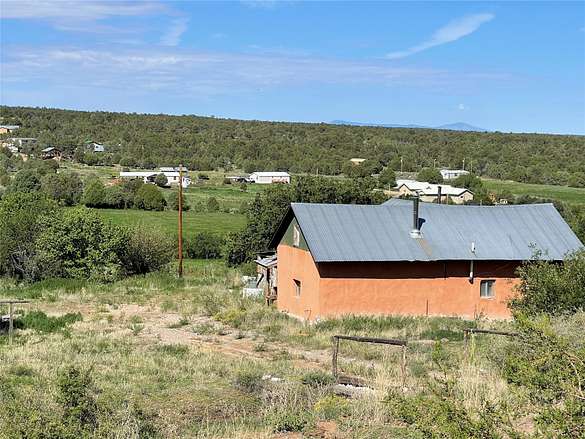 10.4 Acres of Land with Home for Sale in Ojo Sarco, New Mexico