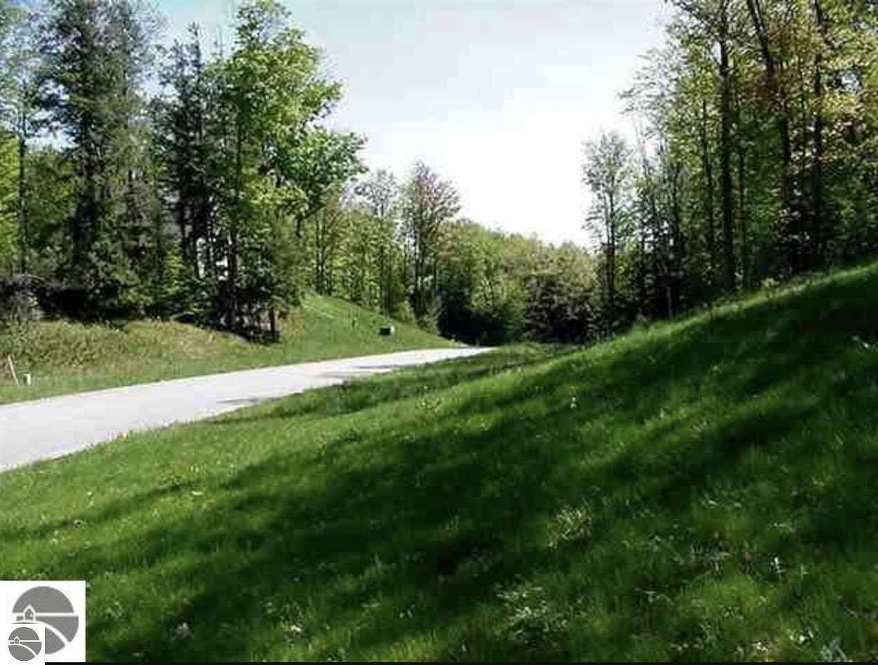 0.89 Acres of Residential Land for Sale in Kewadin, Michigan