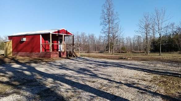 10 Acres of Land with Home for Sale in Mountain View, Arkansas
